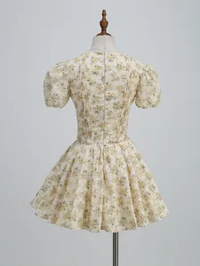 Macro view of the back of a vintage floral dress with puff sleeves and zipper.
