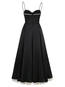 Back view of elegant black spaghetti strap dress with white lace trim and tulle hem