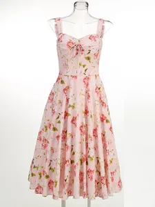 Elegant pink floral print midi dress with lace straps and tie-front detail on mannequin