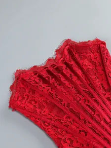 Close-up detailed view of red floral lace and velvet boning on elegant corset evening dress