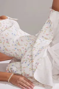 Detailed close-up view of the summer floral print dress with soft white mesh tulle layers.