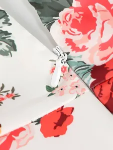 Detailed macro shot of white invisible zipper on a floral print elegant evening dress