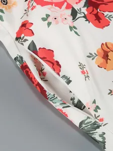 Detailed macro shot of the floral pattern and side pocket on a white elegant dress