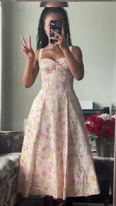 Elegant floral print midi dress featuring a corset bodice and tie-up front detail