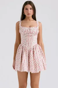 Front view of a summer floral corset mini dress with a puffy skirt shown on a model