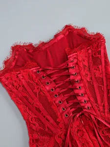 Close-up of red lace corset dress featuring elegant lace-up back and floral embroidery