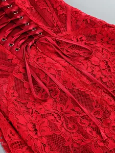 Close-up of red floral lace dress with corset-style lace-up back and satin ribbon