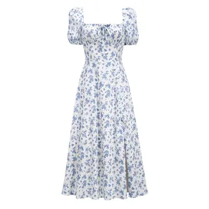 Macro detail of blue floral print and side slit on a square neck French midi dress