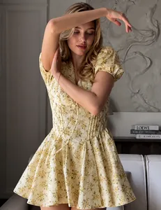 Charming floral V-neck mini dress with puff sleeves perfect for an elegant summer look.