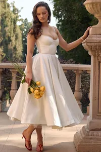 Elegant white bustier midi dress with large swing skirt for formal evening parties.