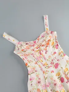 Macro view showing the intricate floral print and delicate lace trim of the corset sundress.