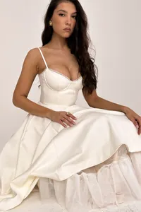 Elegant white satin spaghetti strap bustier dress with voluminous tulle petticoat skirt