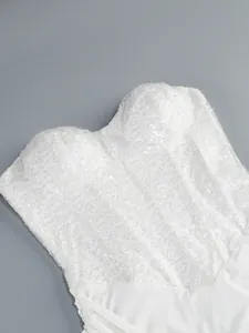 Close-up of white sequin sweetheart neckline bodice with elegant pleating details
