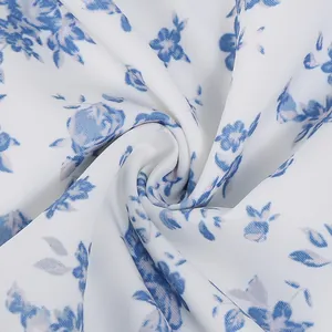 Detailed macro view of smooth white fabric with elegant blue vintage floral pattern