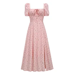 Close-up of pink floral midi dress featuring puff sleeves and square neckline tie