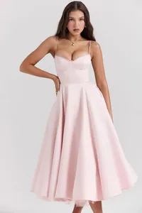 Elegant light pink spaghetti strap corset midi dress with a voluminous A-line skirt