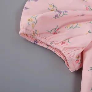 Close-up detail of elasticated cuff on a pink French floral print dress for women