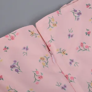 Macro view of the high-quality concealed zipper on this elegant pink floral French dress