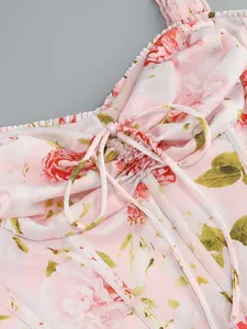 Close-up of pink rose floral print dress featuring a dainty drawstring bow detail