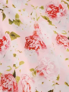 Detail showing elegant pink and white peony floral print on premium soft dress fabric