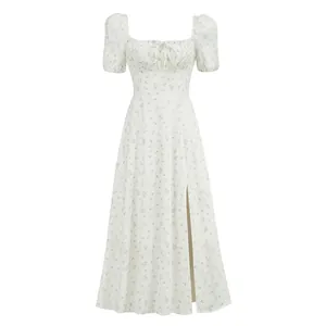 Front view of white French style floral midi dress with puff sleeves and side slit