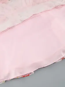 Close-up detail of the smooth pink lining and floral hem on this elegant midi dress
