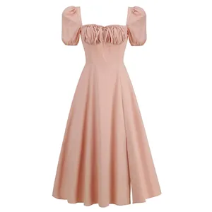 Detail view of an elegant pink French style dress with puff sleeves and square neckline