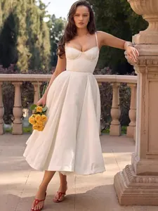 Elegant white corset midi dress with full A-line skirt and delicate spaghetti straps