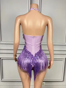 Back view detail of purple halter bodysuit with layered fringe and crystal accents