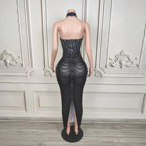 Detailed back view of luxury black halter dress with intricate rhinestone beaded chains