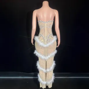 Back view of luxury silver rhinestone dress with white feather trim for evening gala