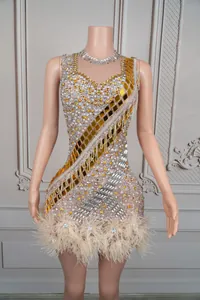 Detailed look at the sparkling rhinestones and gold mirror tiles on the fringe stage dress