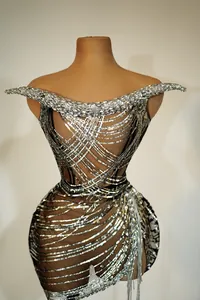 Detailed macro view of sparkling silver sequins and rhinestones on sexy club dress.