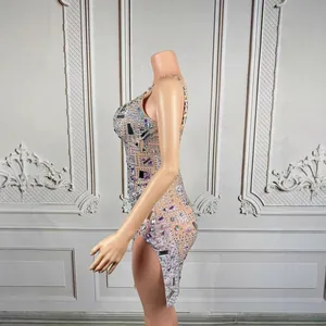 Side view detail of a sparkling rhinestone dress with crystal mirror accents and side slit.
