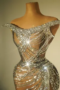 Detailed close-up view of a sparkly silver sequin and rhinestone evening dress design