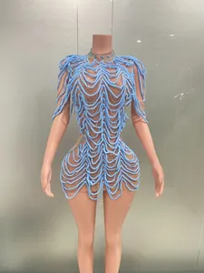 Detailed view of light blue avant-garde party dress with wavy fringe and crystals