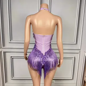 Stunning purple halter backless bodysuit featuring long fringe and sequin details