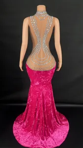 Back detail of a glamorous fuchsia velvet floor-length gown with sparkling rhinestones
