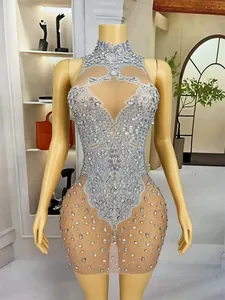 Detailed view of silver rhinestone embellishments on a sheer mesh stage bodysuit