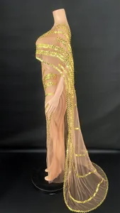 Elegant gold sequin mesh evening gown with stylish cape design shown in side view detail