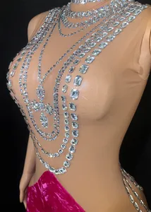 Close-up detail of luxury rhinestone embellishments on mesh bodice of velvet gown