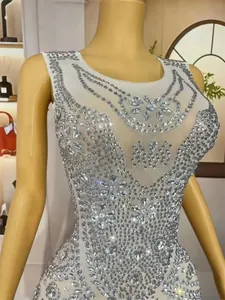 Detailed view of luxury mermaid dress with intricate rhinestone floral patterns