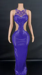 Stunning purple evening gown with side cutouts and shimmering crystal chain detail
