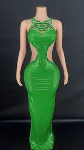 Detail showing the intricate green beadwork and side cut-outs on this elegant evening gown