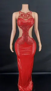 Detailed view of red sequin evening gown with side cutouts and beadwork