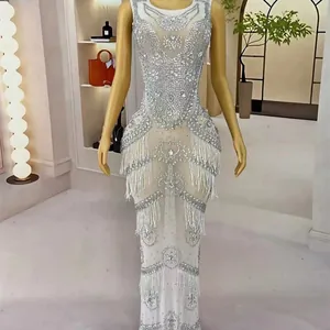 Luxury white mermaid evening gown decorated with silver rhinestones and fringe details