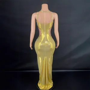 Elegant sexy gold cutout evening gown with rhinestone trim shown from the back view
