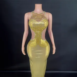 Elegant gold cutout maxi dress with full diamond chains and slim fit design