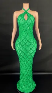 Detailed view of a green halter neck sequined evening gown with teardrop crystals