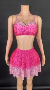 Luxurious fuchsia two-piece set with full rhinestones, mini skirt, and iconic panther charm
